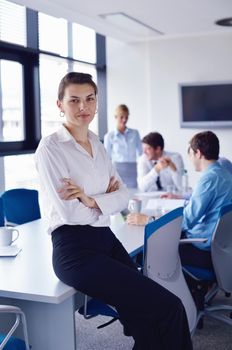 business woman  with her staff,  people group in background at modern bright office indoors