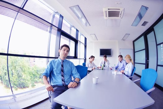 Group of happy young  business people in a meeting at office