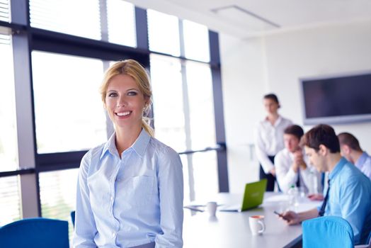 business woman  with her staff,  people group in background at modern bright office indoors