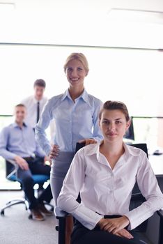 business woman  with her staff,  people group in background at modern bright office indoors