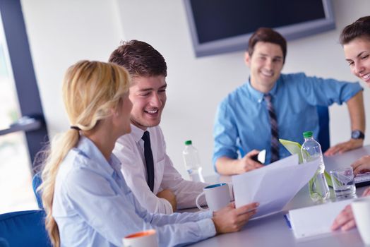 Group of happy young  business people in a meeting at office