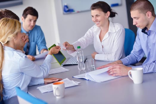 Group of happy young  business people in a meeting at office