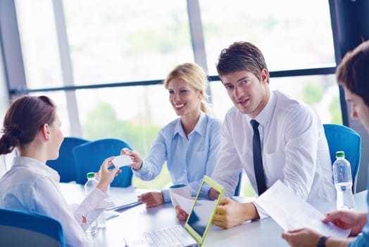 Group of happy young  business people in a meeting at office