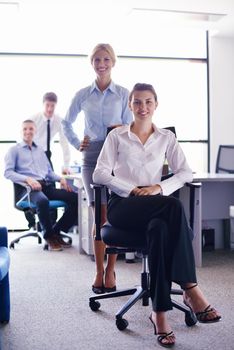 business woman  with her staff,  people group in background at modern bright office indoors