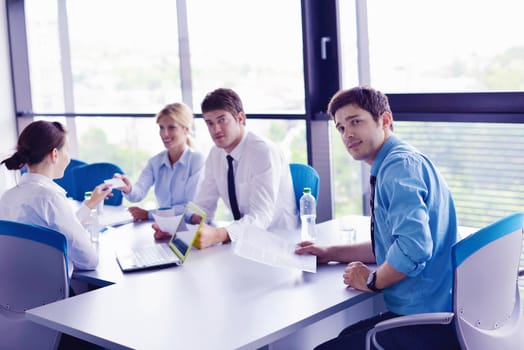 Group of happy young  business people in a meeting at office