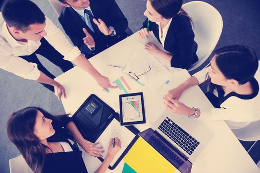 Group of happy young  business people in a meeting at office