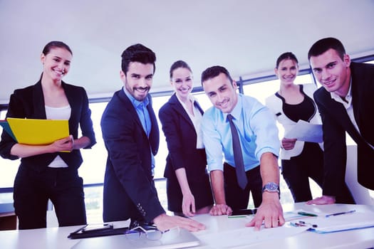 Group of happy young  business people in a meeting at office