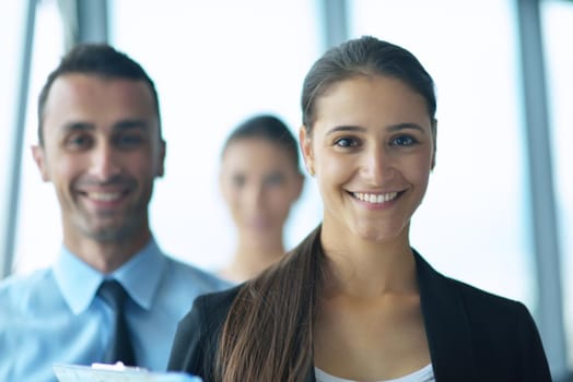 Group of happy young  business people in a meeting at office