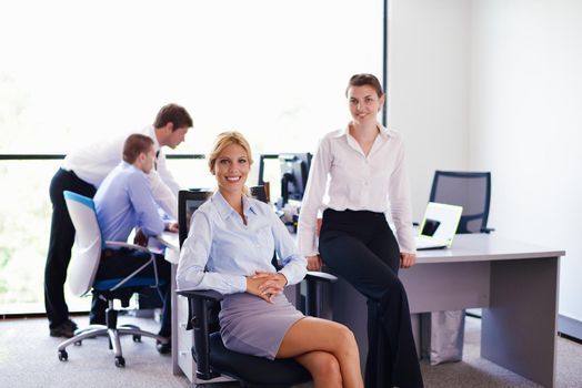 business woman  with her staff,  people group in background at modern bright office indoors