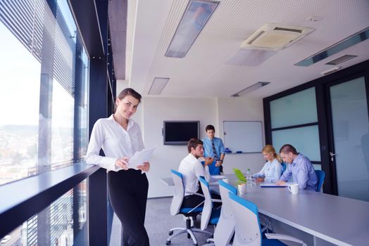 business woman  with her staff,  people group in background at modern bright office indoors