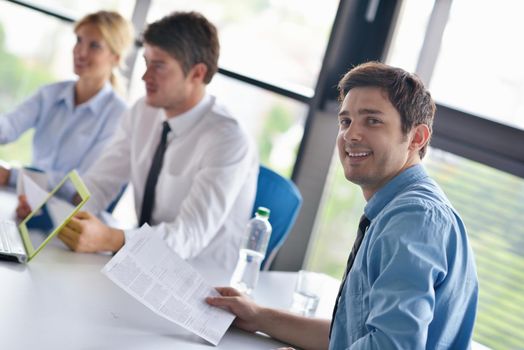 Group of happy young  business people in a meeting at office