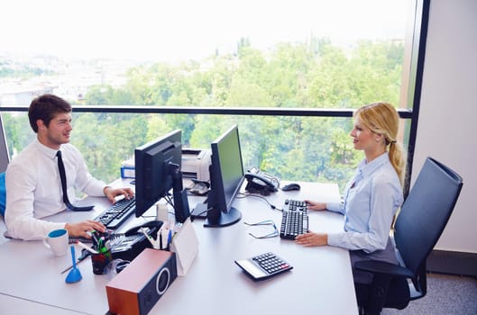 Group of happy young  business people in a meeting at office