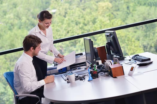 Group of happy young  business people in a meeting at office