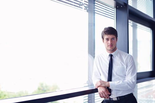 happy young business  man work in modern office on computer