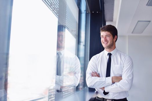 happy young business  man work in modern office on computer