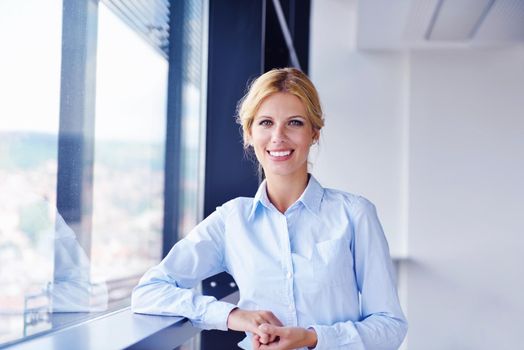 business woman  with her staff,  people group in background at modern bright office indoors