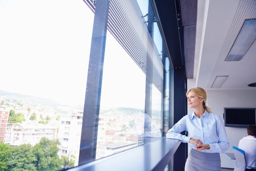 business woman  with her staff,  people group in background at modern bright office indoors