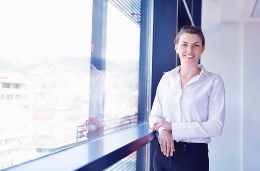 business woman  with her staff,  people group in background at modern bright office indoors