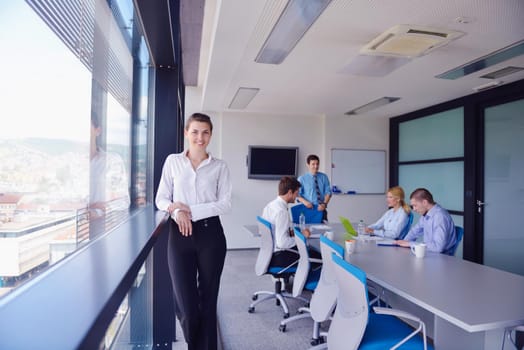 Group of happy young  business people in a meeting at office