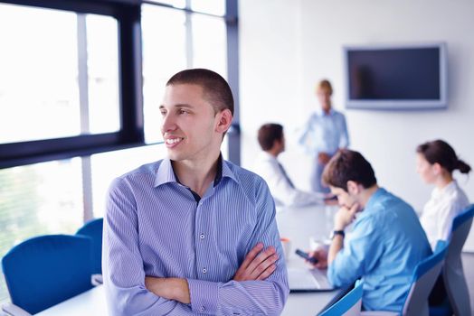 Group of happy young  business people in a meeting at office