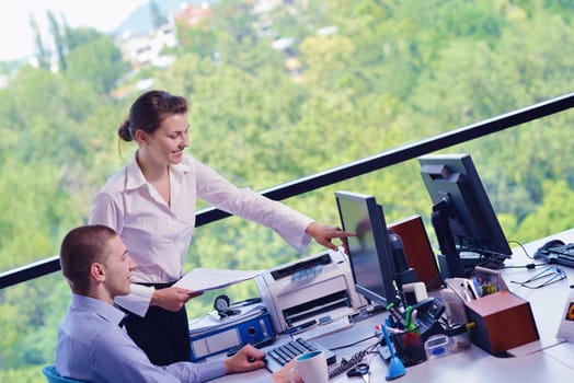 Group of happy young  business people in a meeting at office