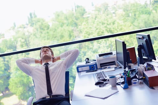 happy young business  man work in modern office on computer