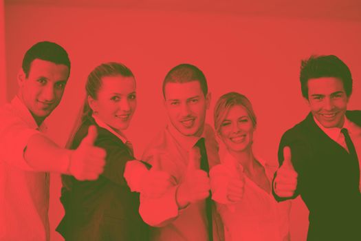 Group of young business people sitting in board room during meeting and discussing with paperwork