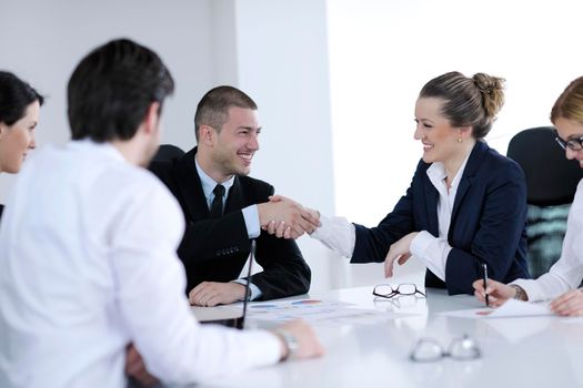 Group of happy young  business people in a meeting at office