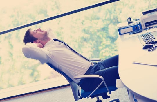 happy young business  man work in modern office on computer