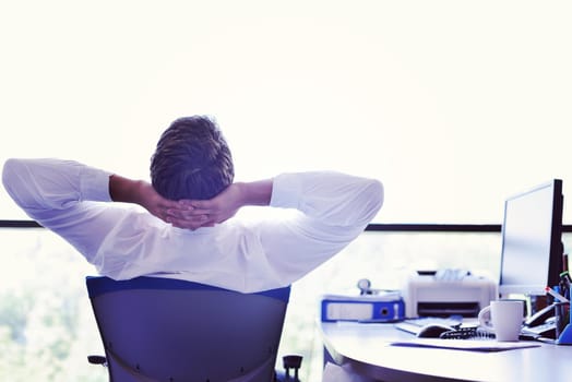 happy young business  man work in modern office on computer