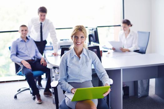 business woman  with her staff,  people group in background at modern bright office indoors