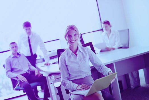 business woman  with her staff,  people group in background at modern bright office indoors