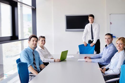 Group of happy young  business people in a meeting at office