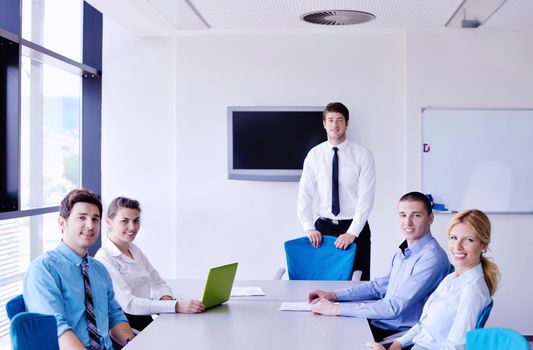 Group of happy young  business people in a meeting at office