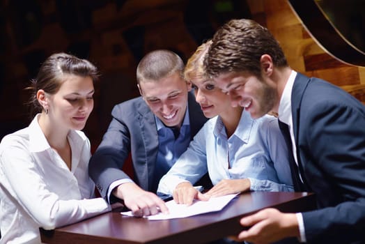 Group of happy young  business people in a meeting at office