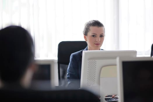 business people group with  headphones giving support in  help desk office to customers, manager giving training and education instructions