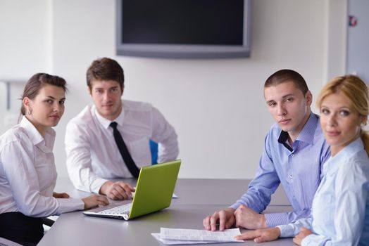 Group of happy young  business people in a meeting at office