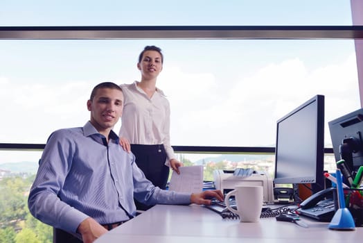 Group of happy young  business people in a meeting at office