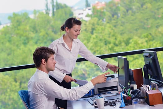 Group of happy young  business people in a meeting at office