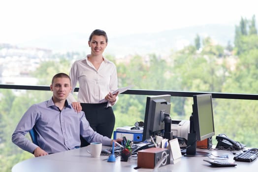 Group of happy young  business people in a meeting at office