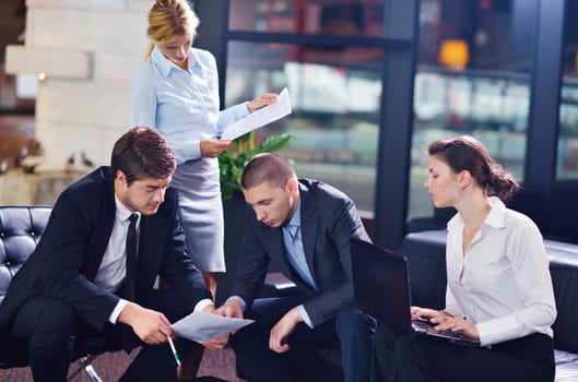 Group of happy young  business people in a meeting at office