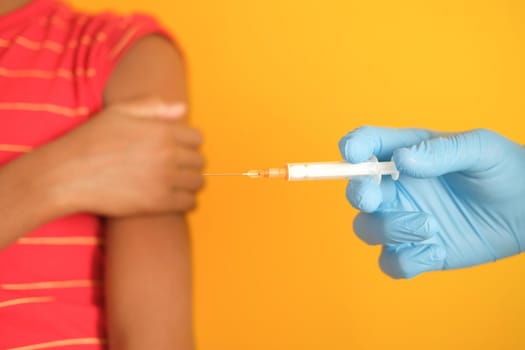 doctor hand in medical gloves holding syringe