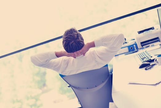 happy young business  man work in modern office on computer