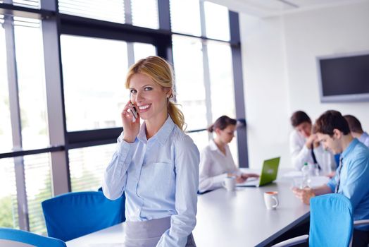 business woman  with her staff,  people group in background at modern bright office indoors