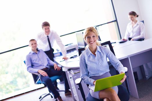 business woman  with her staff,  people group in background at modern bright office indoors