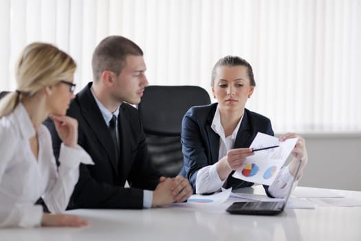 Group of happy young  business people in a meeting at office