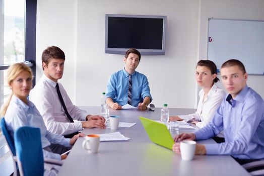 Group of happy young  business people in a meeting at office