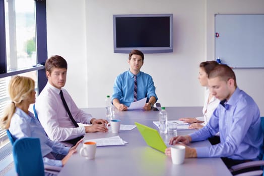 Group of happy young  business people in a meeting at office