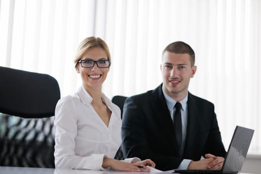 Group of happy young  business people in a meeting at office