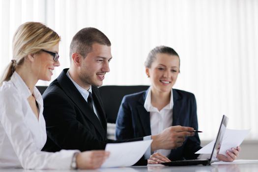 Group of happy young  business people in a meeting at office